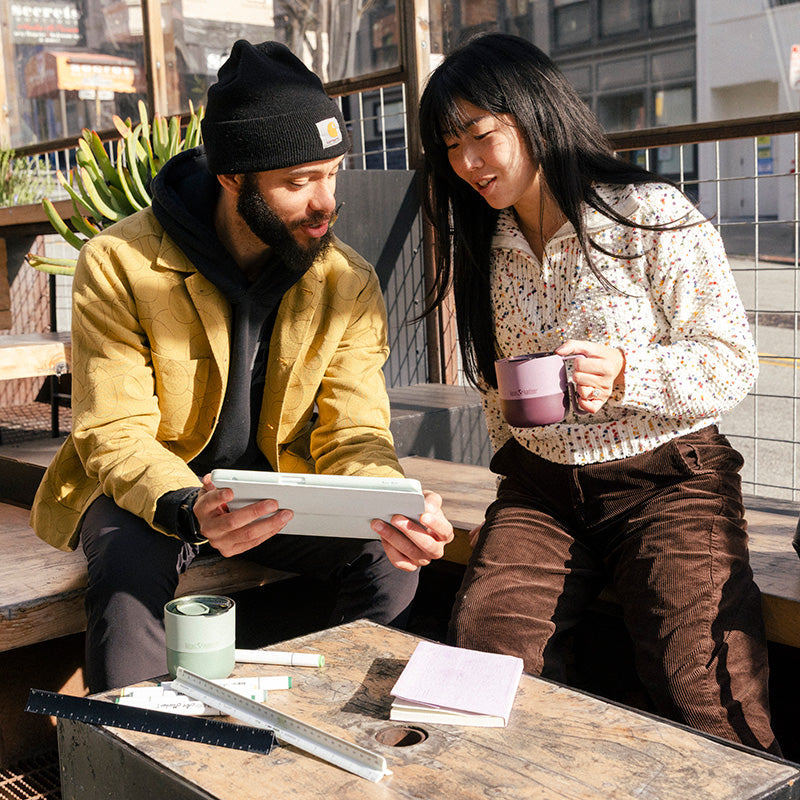 12oz-rise-mug-l5 12oz_rise_coffee_mug_dusty_orchid_couple_city_patio_square.jpg