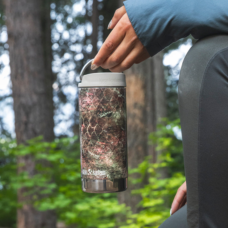 12oz-tkwide-with-cafe-cap-mossy-oak-x1 12oz_tumbler_mossyoak_rainbowtrout_hand_closeup_square.jpg