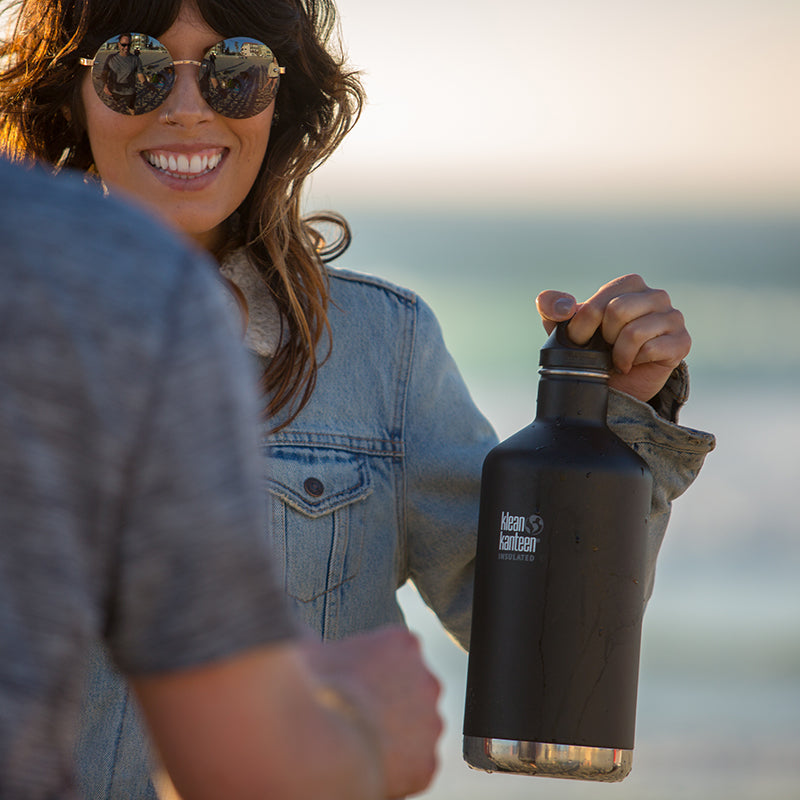 64oz-classic-with-loop-cap-k8 64oz_insulated_classic_black_beach_girl_hand_square.jpg